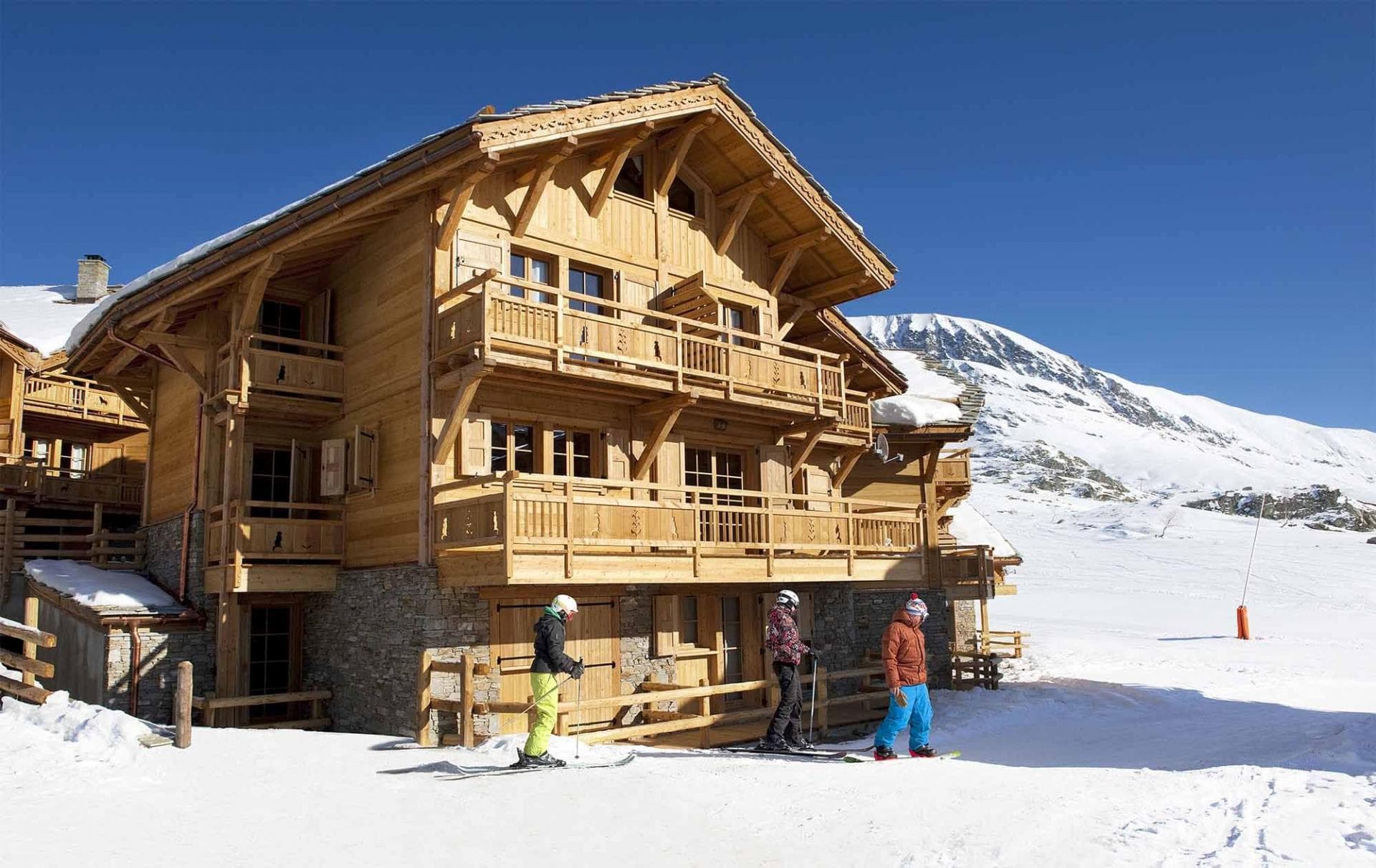 Ski-in, ski-out timber chalet with private balconies and mountain views