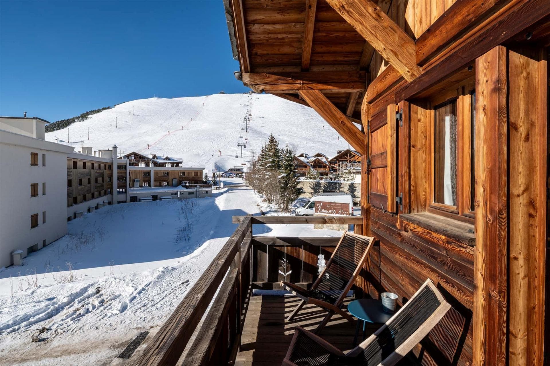 Private balcony with lounge seating and direct ski-in/ski-out mountain views
