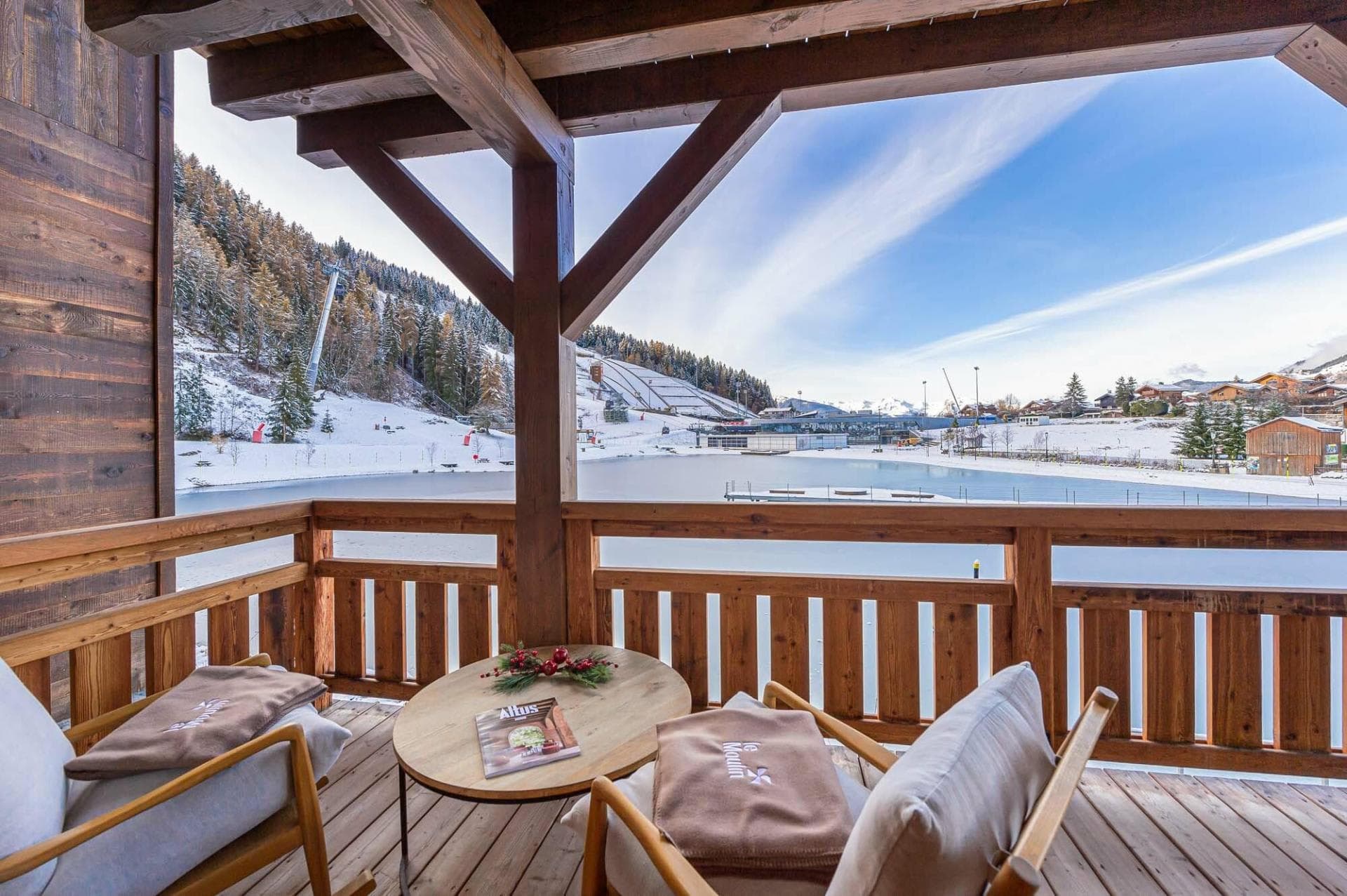 Private balcony overlooking the ski slopes and village lake