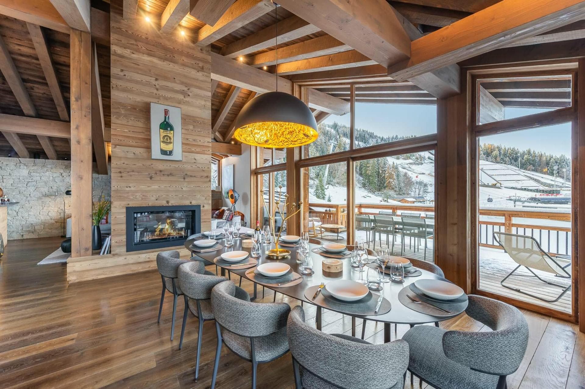 Dining area for 10 with gas fireplace and ski-in/ski-out views