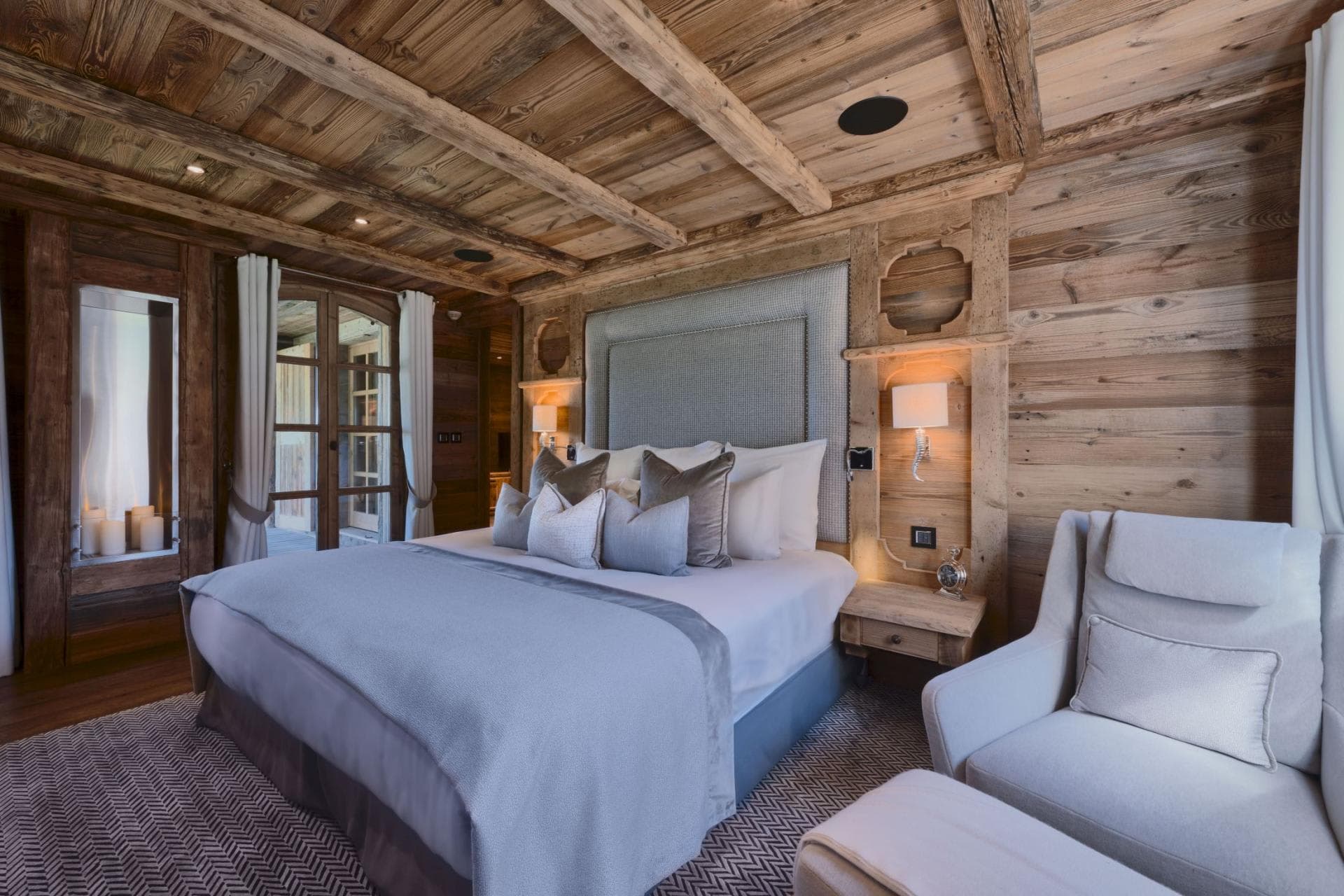 Primary bedroom with king bed and reclaimed wood ceilings