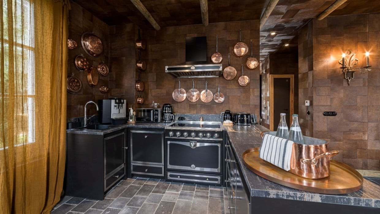 Chef's kitchen with Lacanche range and copper cookware collection