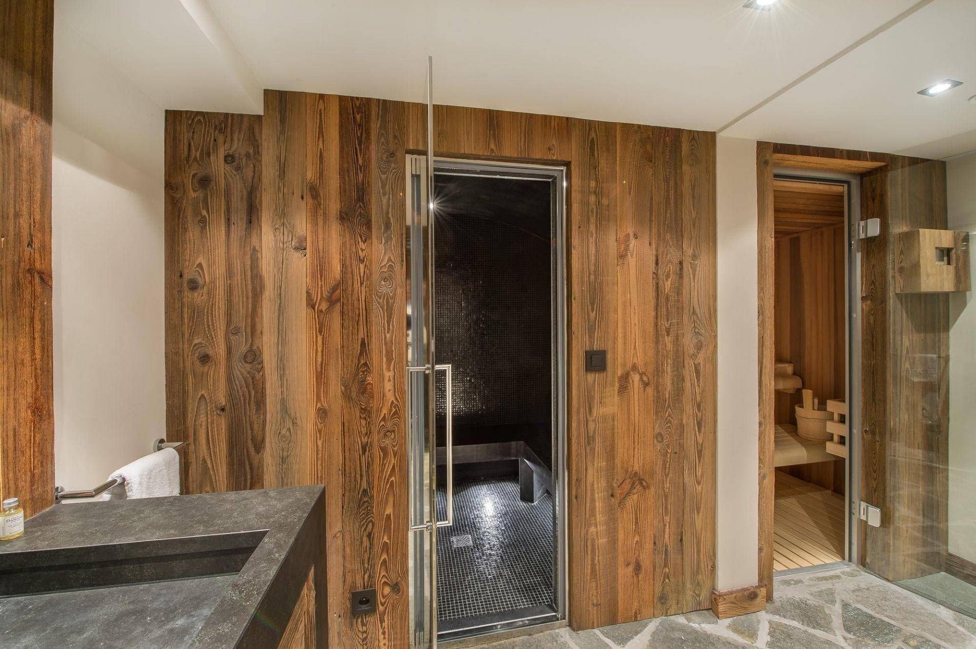 Private spa area featuring a steam room and cedar sauna
