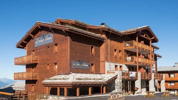 Chalet exterior featuring private balconies and proximity to ski slopes
