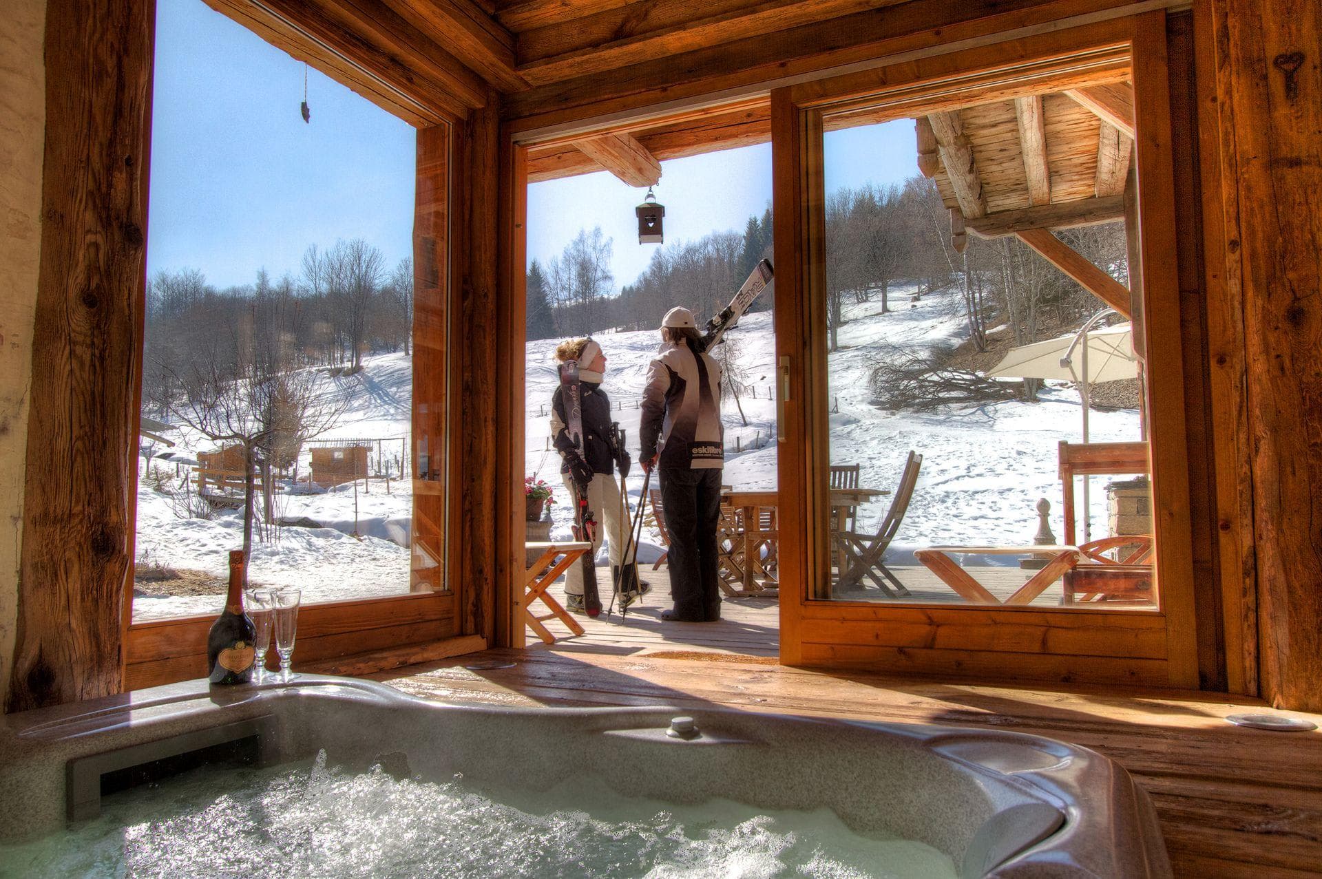 Indoor hot tub with sliding door access to ski-in/ski-out deck
