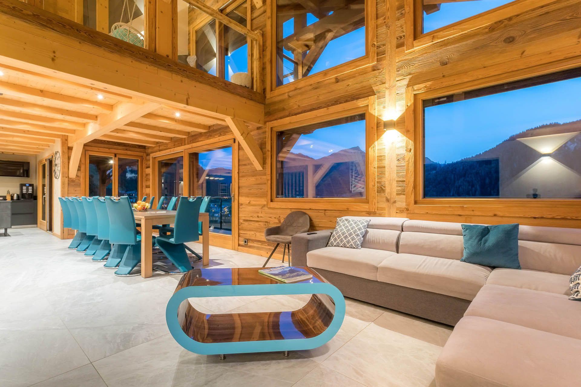 Open-plan living area with dining seating for 10 and mountain views