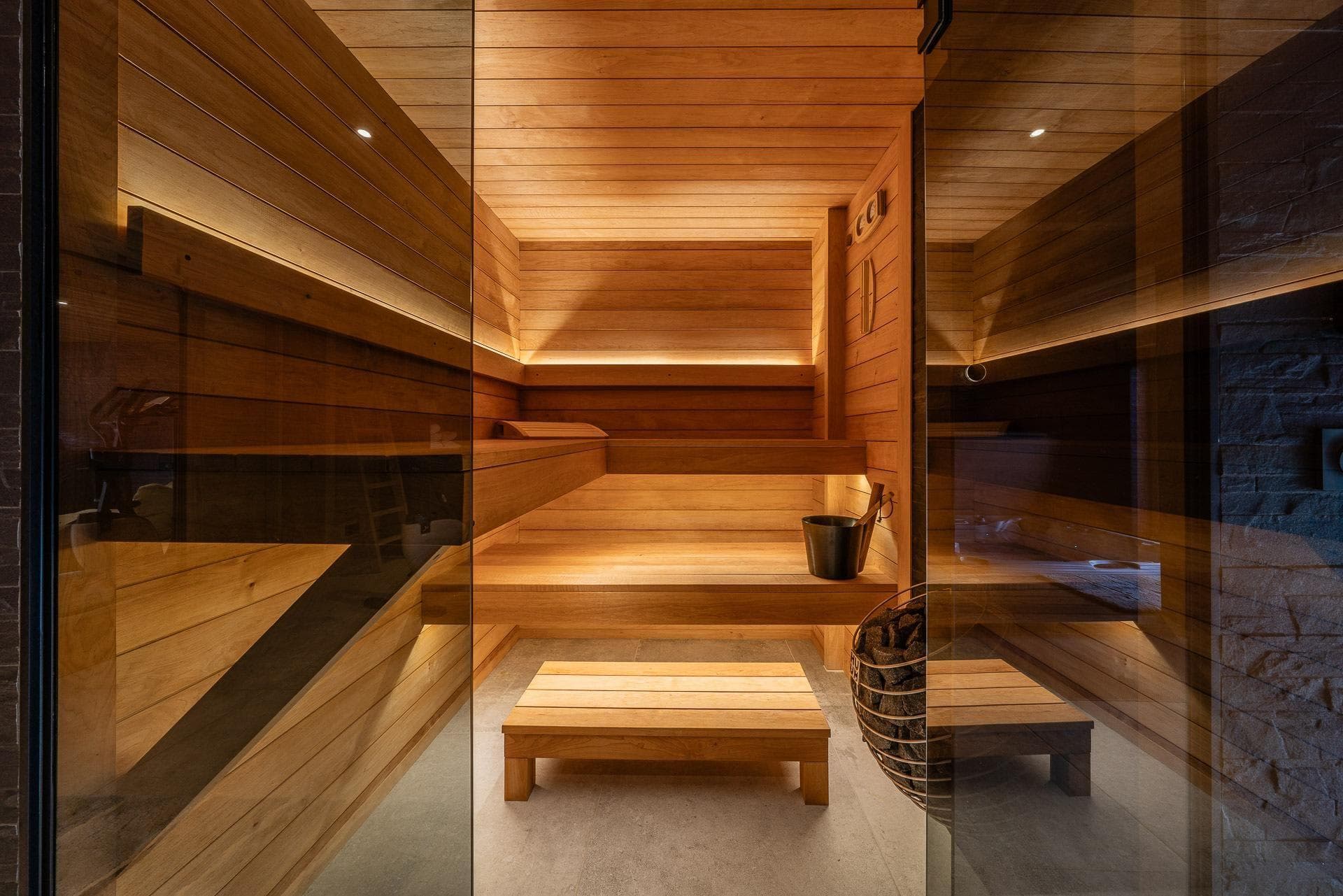 Sauna with tiered seating and integrated LED accent lighting