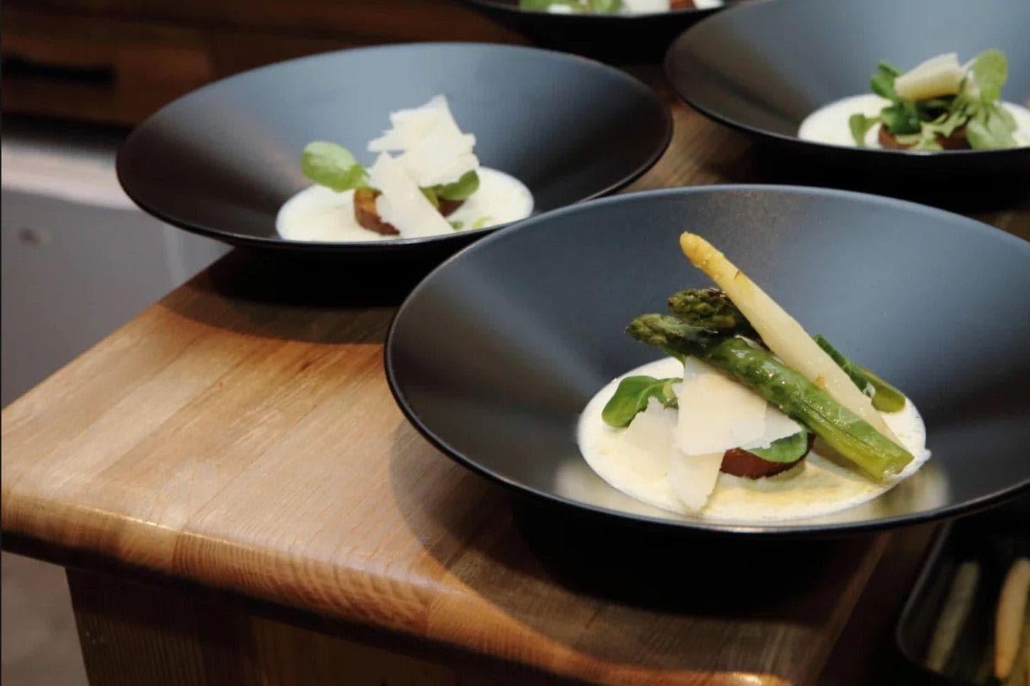 Plated gourmet meals; private chef services available for guest bookings