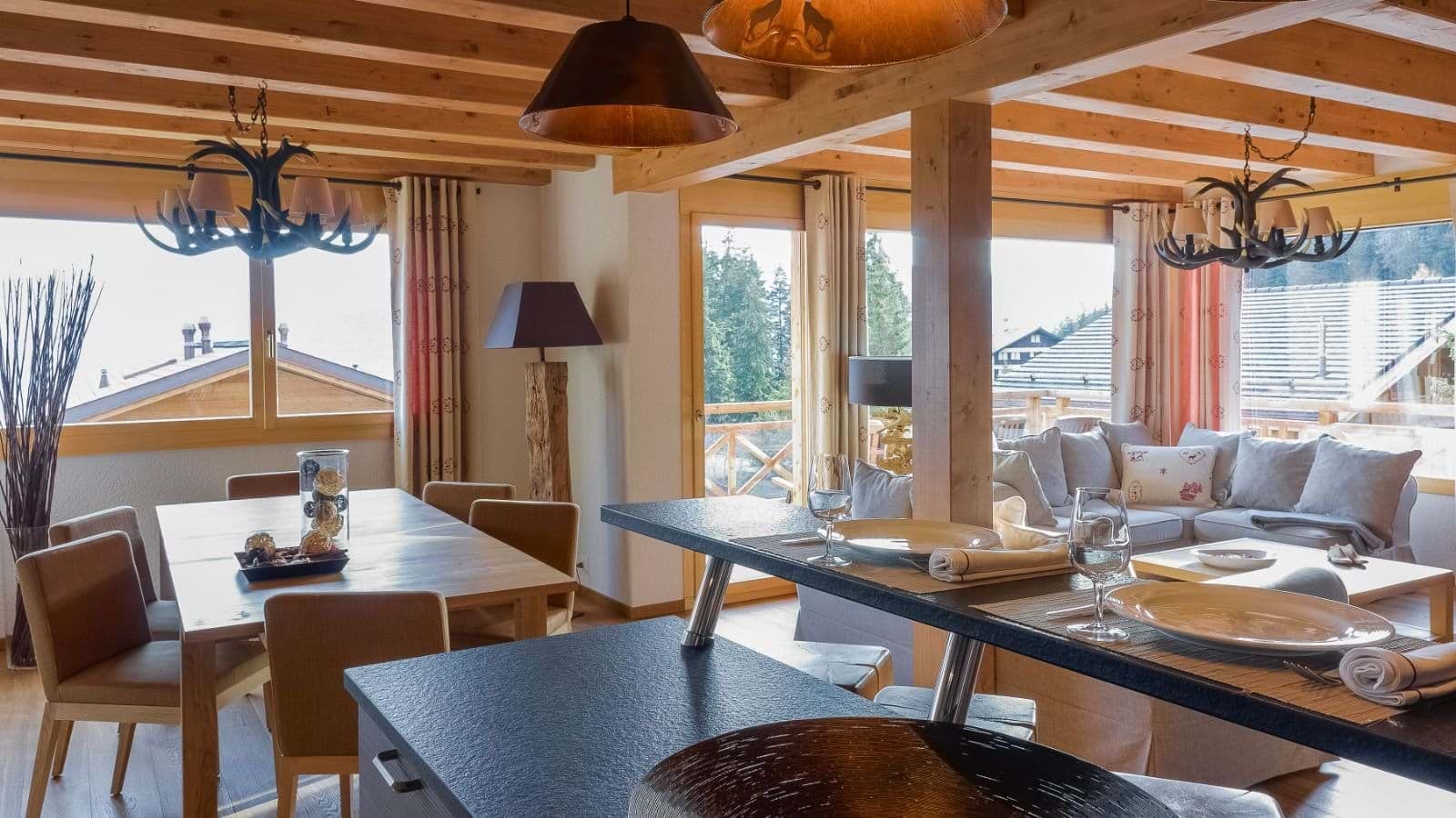 Open-plan living area with dining for 8 and balcony access