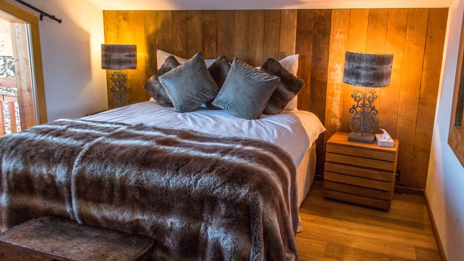 Bedroom with king bed and private balcony access