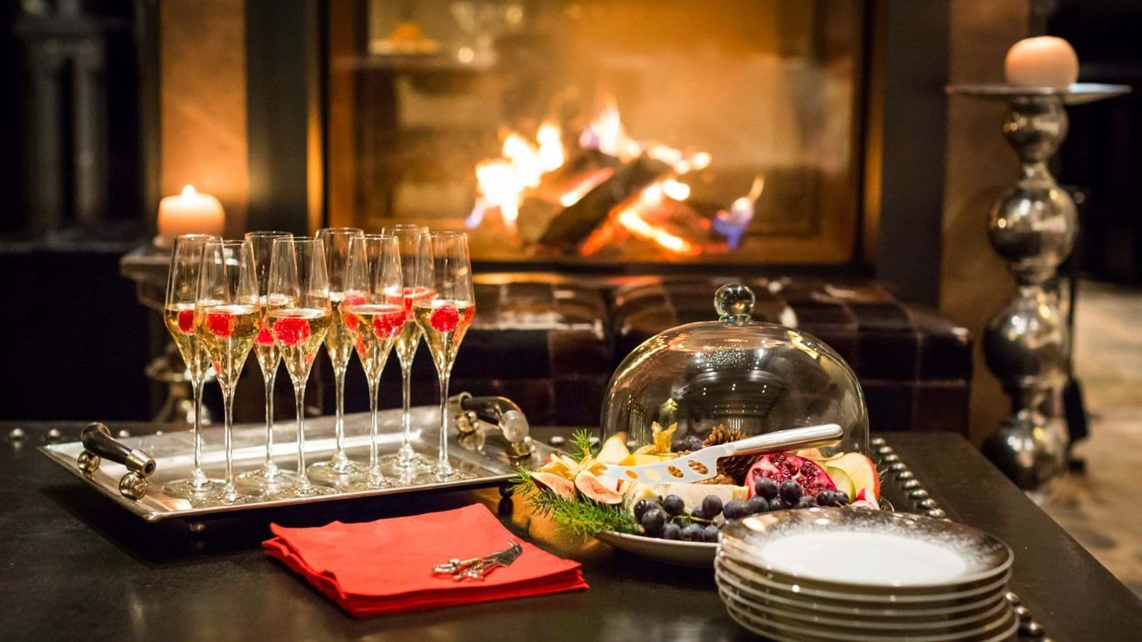 Welcome drinks and appetizers by the living room wood-burning fireplace