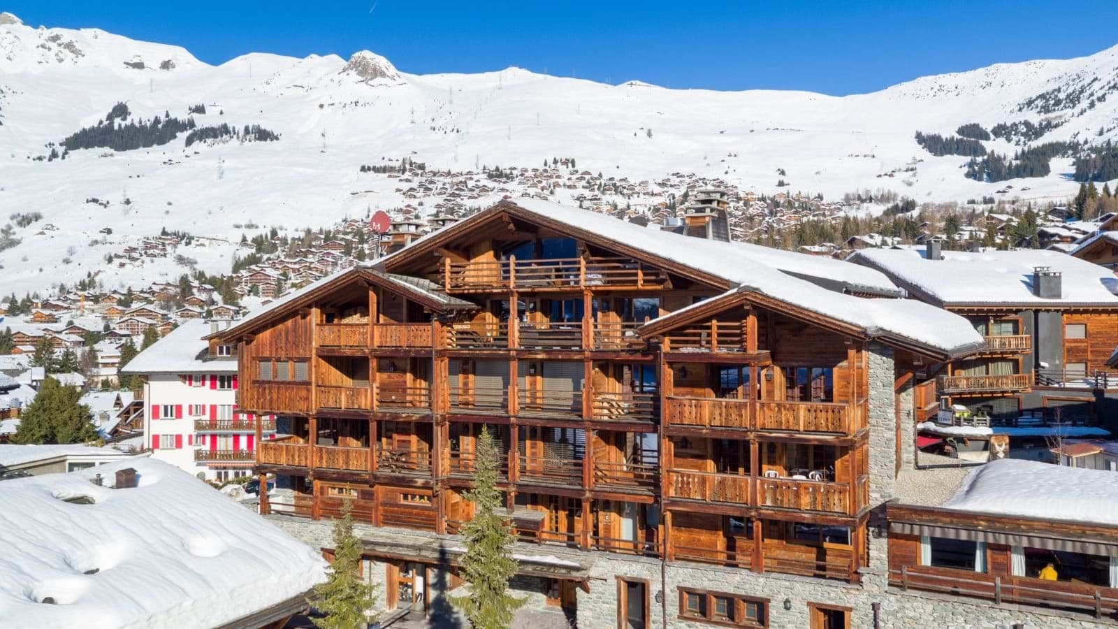 Ski-in, ski-out timber chalet with private balconies and mountain views