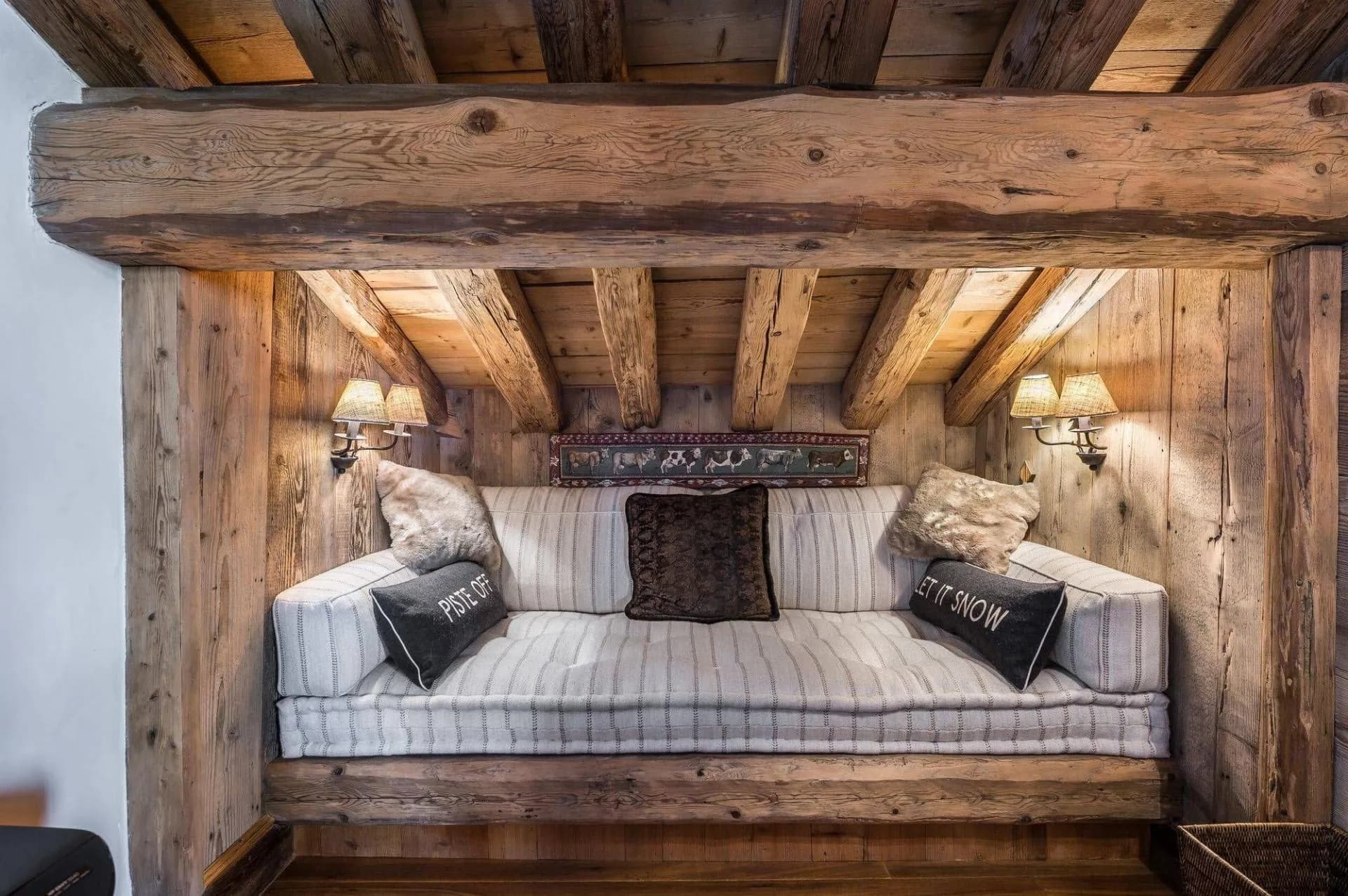 Upholstered alcove seat beneath timber beams