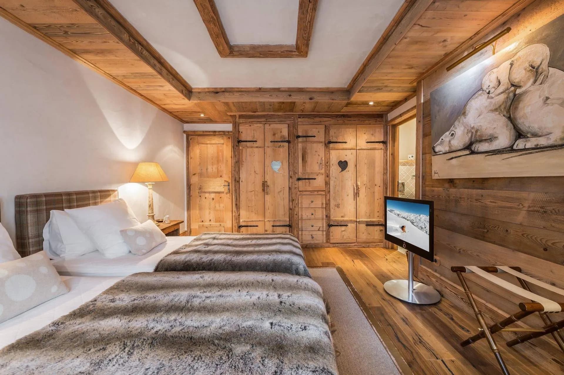 Double bedroom with timber wardrobes and skylight