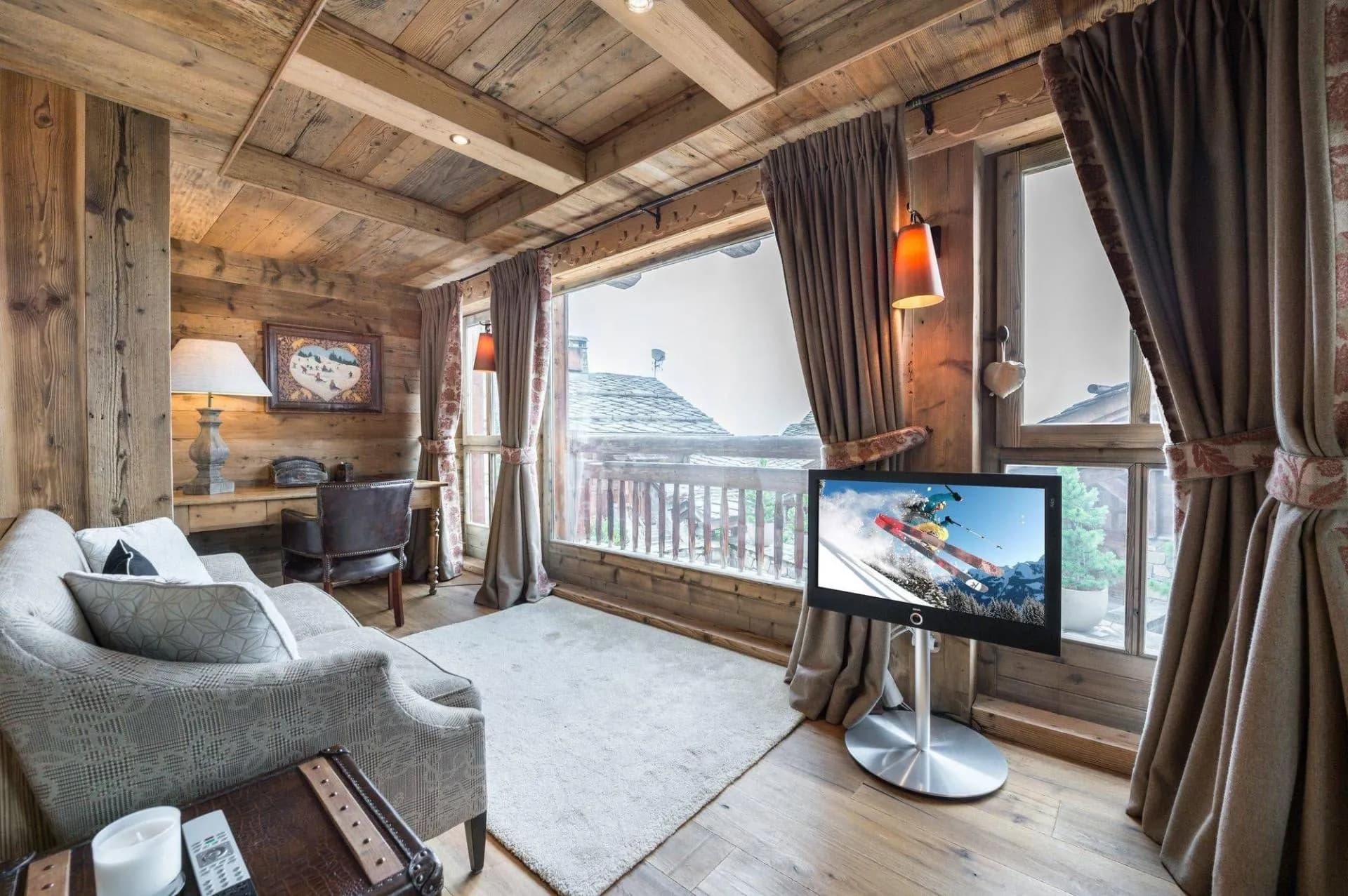 Bedroom sitting area with television and balcony doors