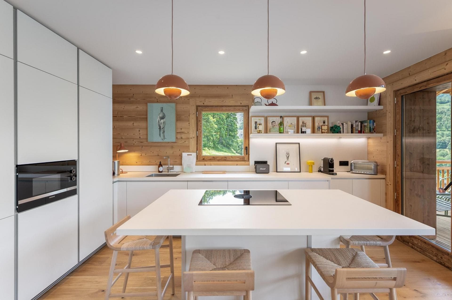 Kitchen island with induction cooktop and bar seating for 3