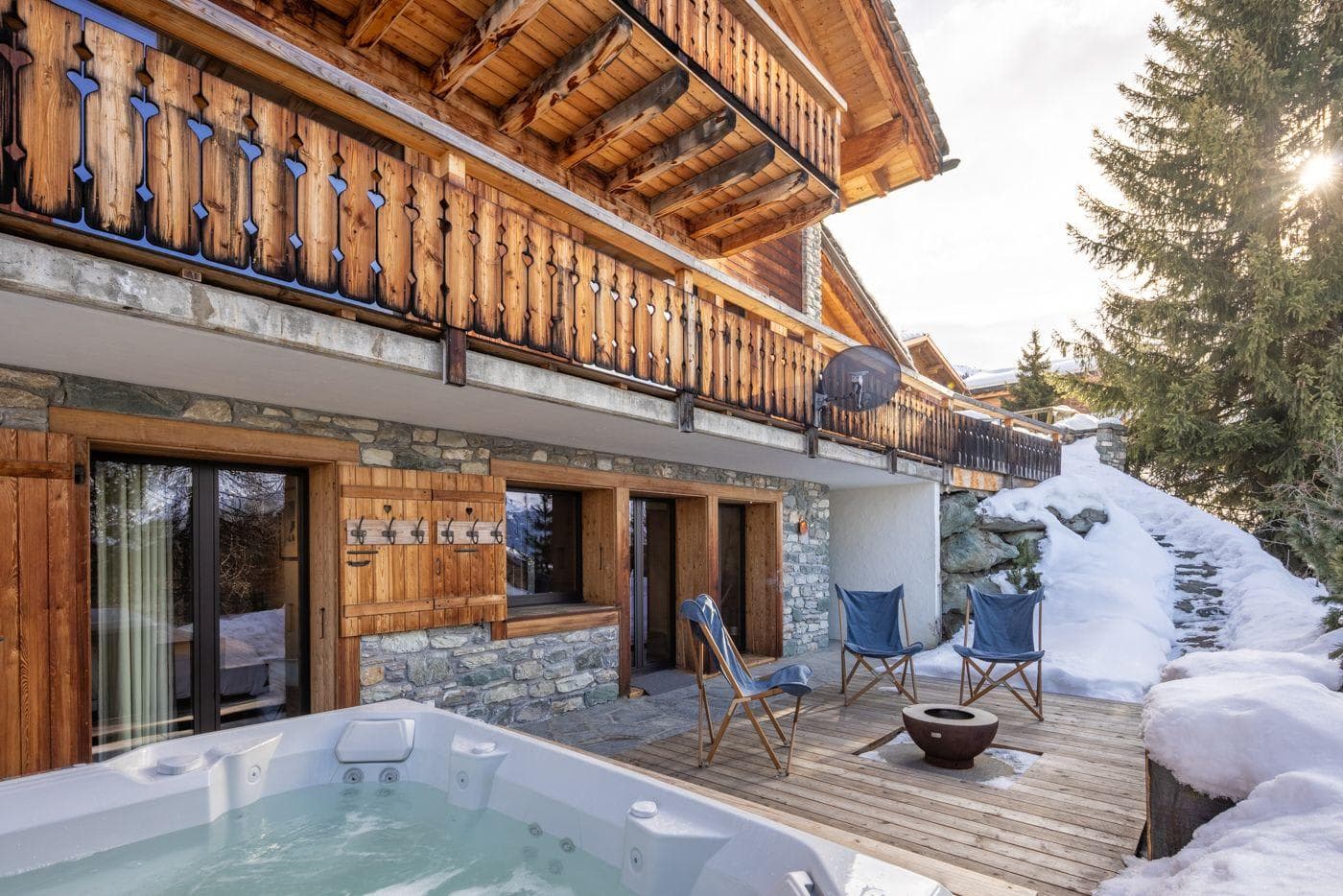 Outdoor hot tub and fire pit bowl on ground-floor deck