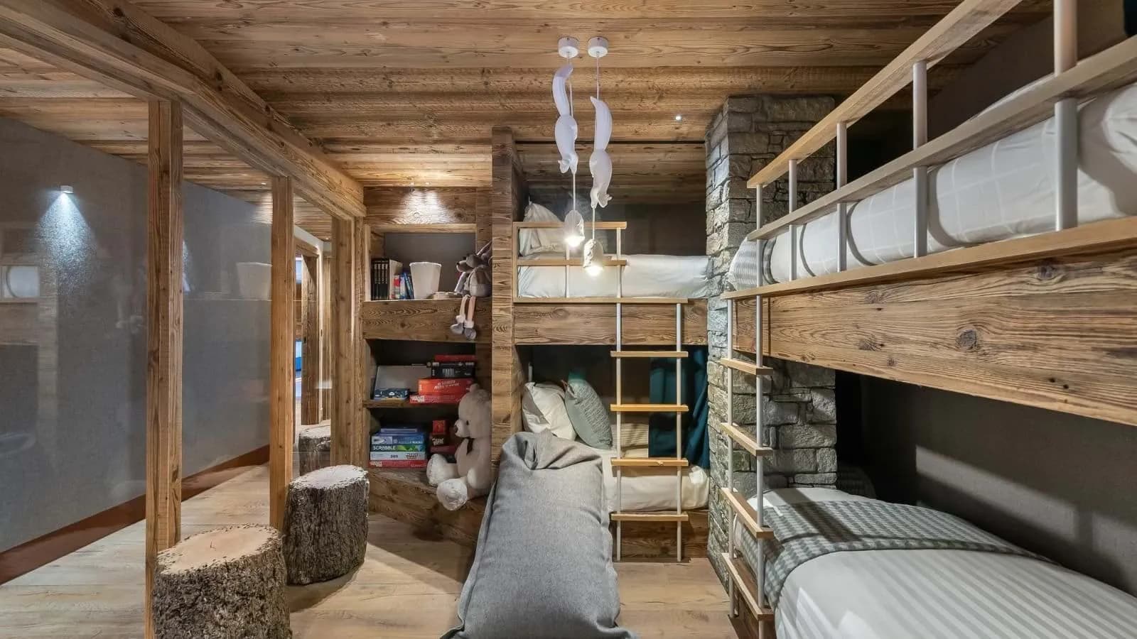 Children's bedroom with built-in bunk beds, shelving and beanbag seating