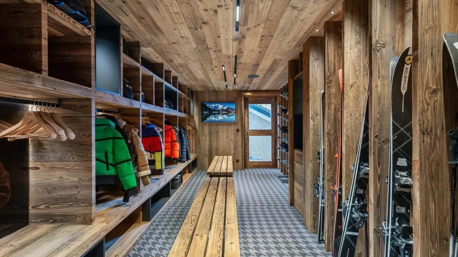 Ski room with equipment lockers, bench seating and boot warmers