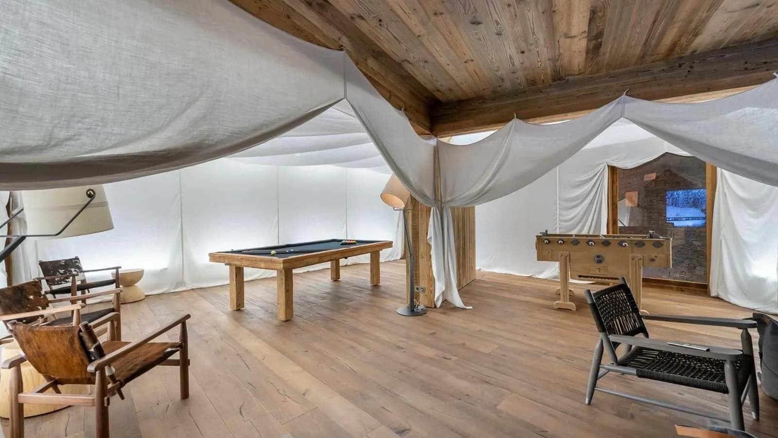 Games room with a pool table and table football