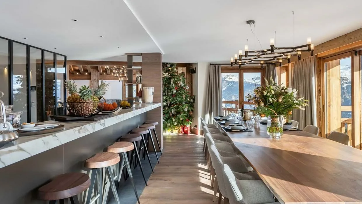Dining area with a marble breakfast bar and mountain views