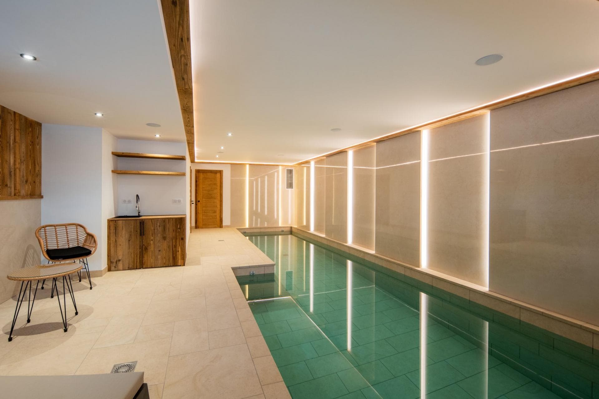 Indoor swimming pool with heated floors; wet room and kitchenette access