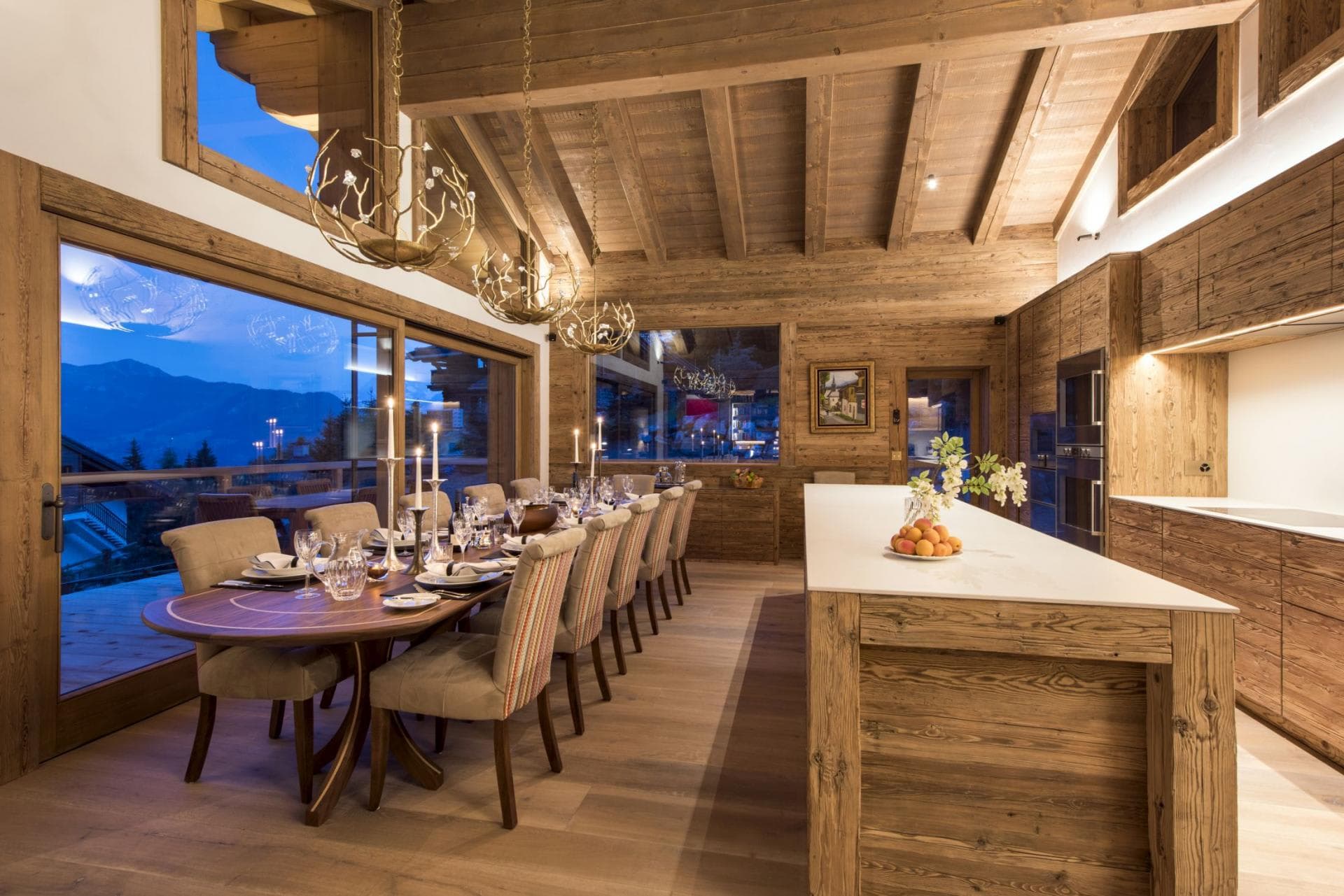 Dining area for 12 with mountain views and adjacent marble island