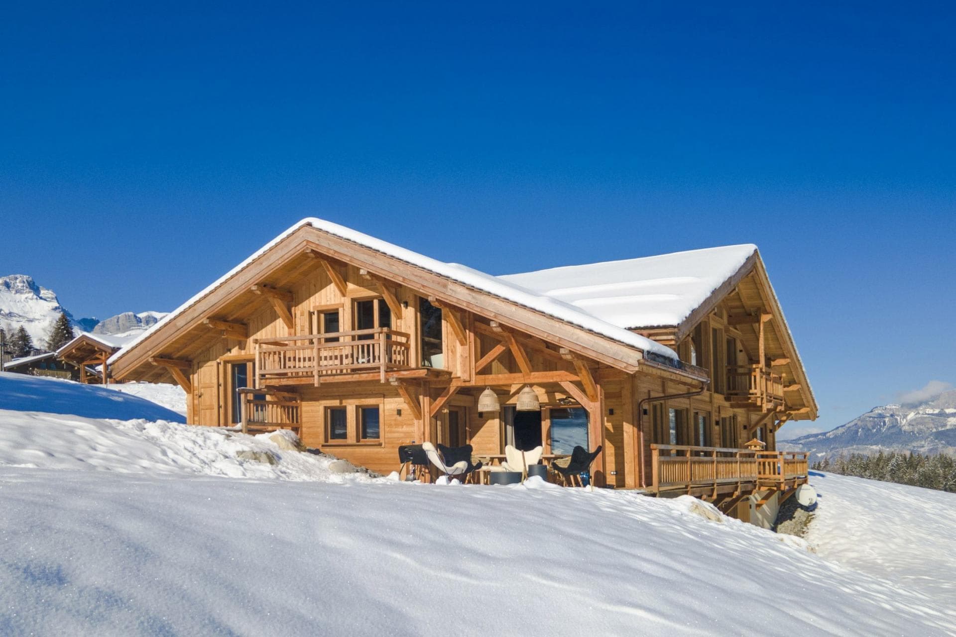 Ski-in/ski-out timber chalet with wraparound deck and mountain views