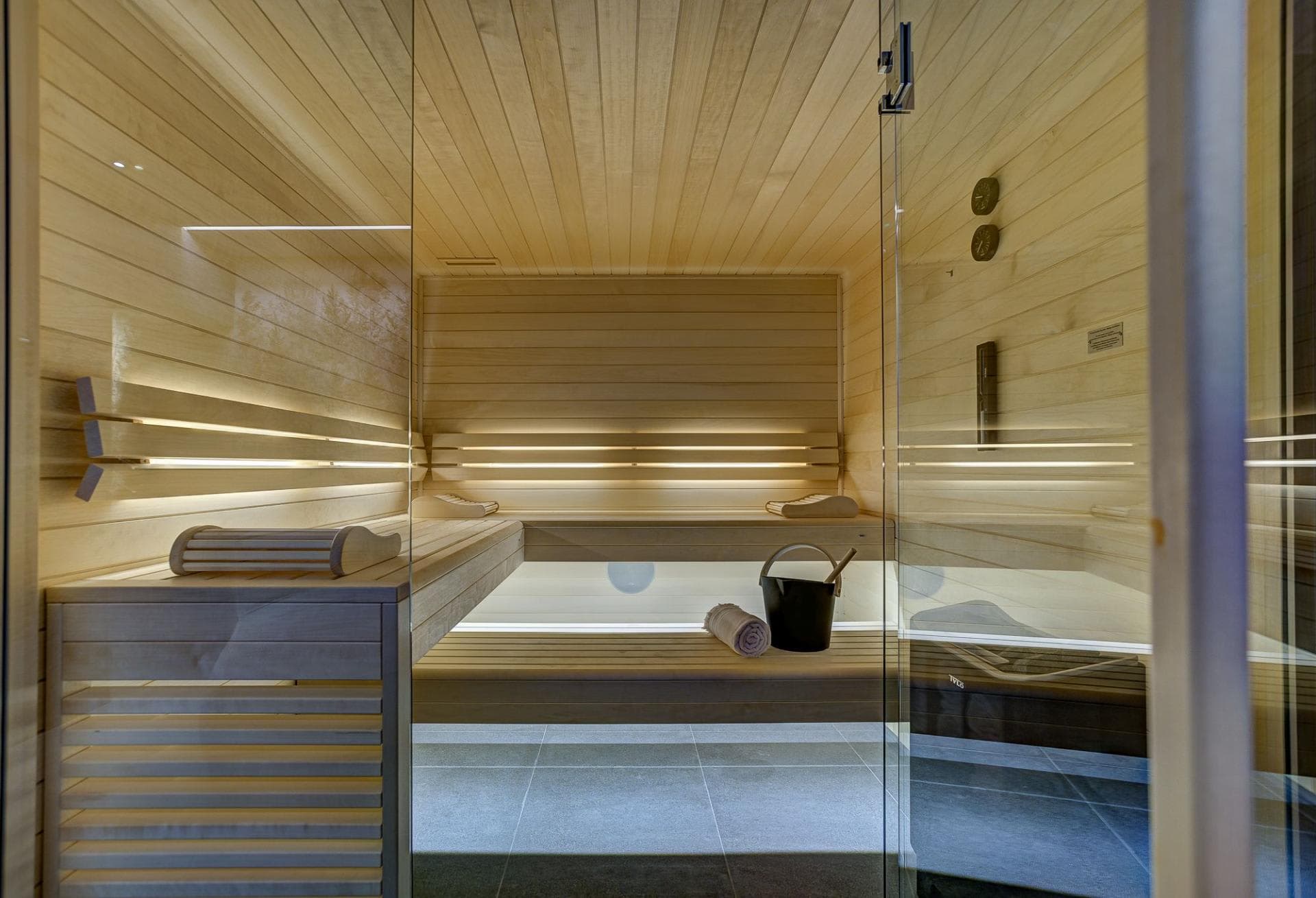 Private cedar sauna with tiered seating and integrated LED lighting