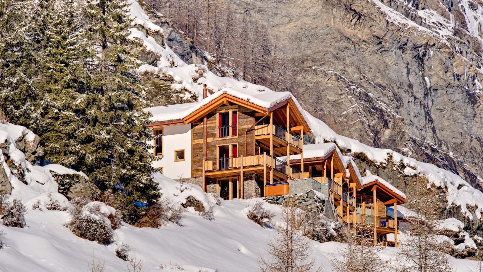 Ski-in/ski-out timber chalet with private balconies and outdoor hot tub
