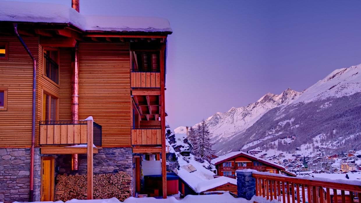 Chalet exterior with private balconies and mountain views