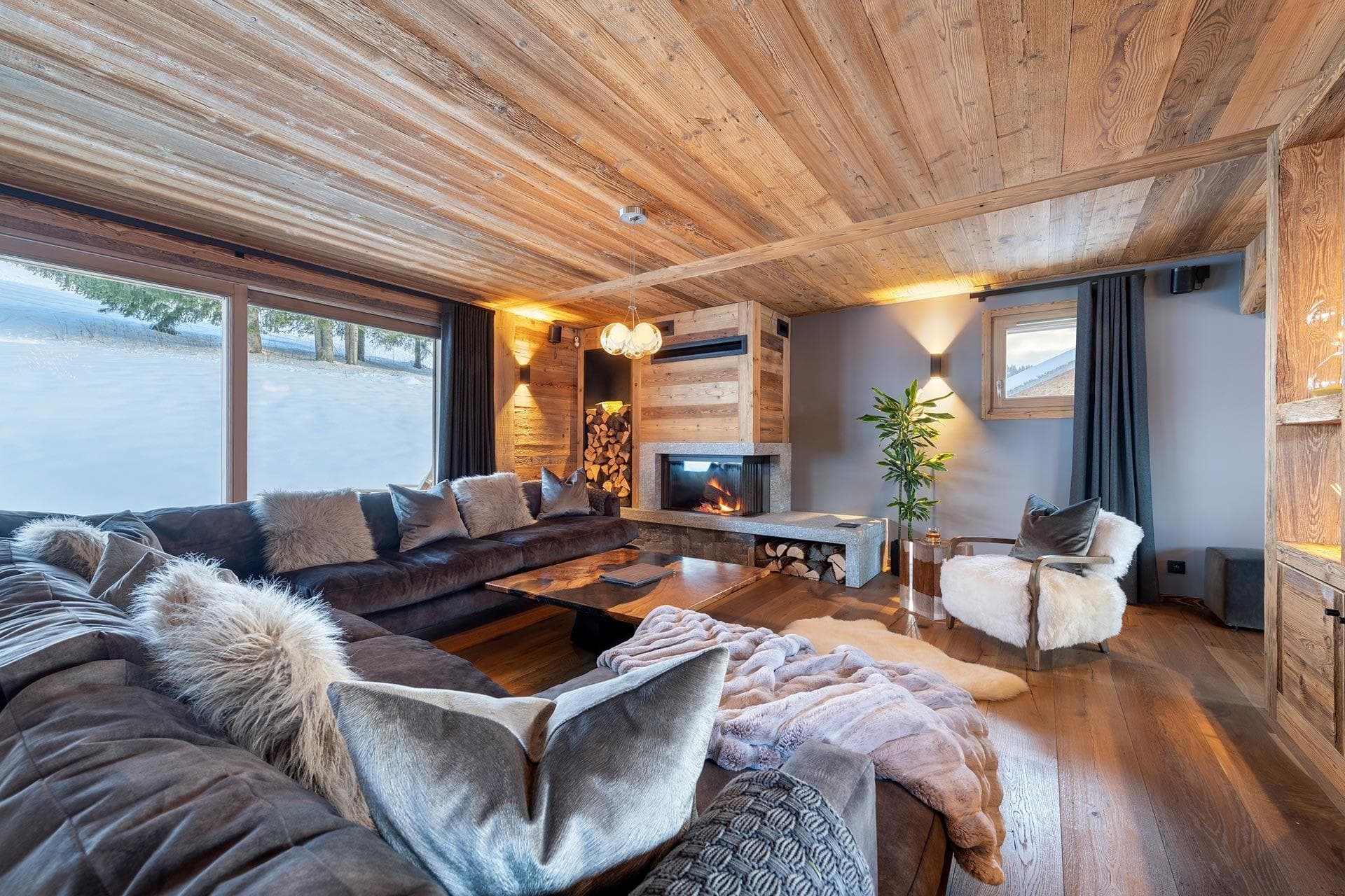 Living area with wood-burning fireplace and sectional seating for 8