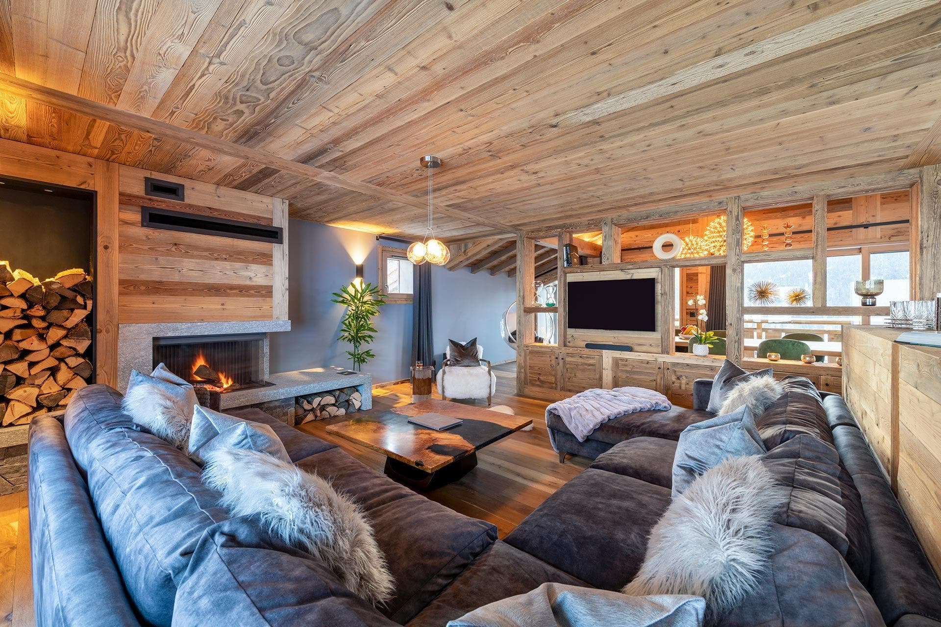 Living area with wood-burning fireplace and sectional seating for 8