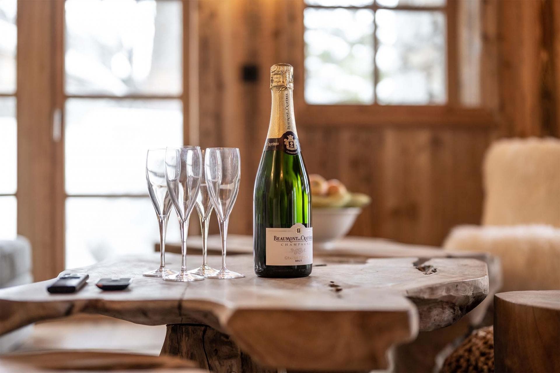 Living area with live-edge wood coffee table and reclaimed timber walls
