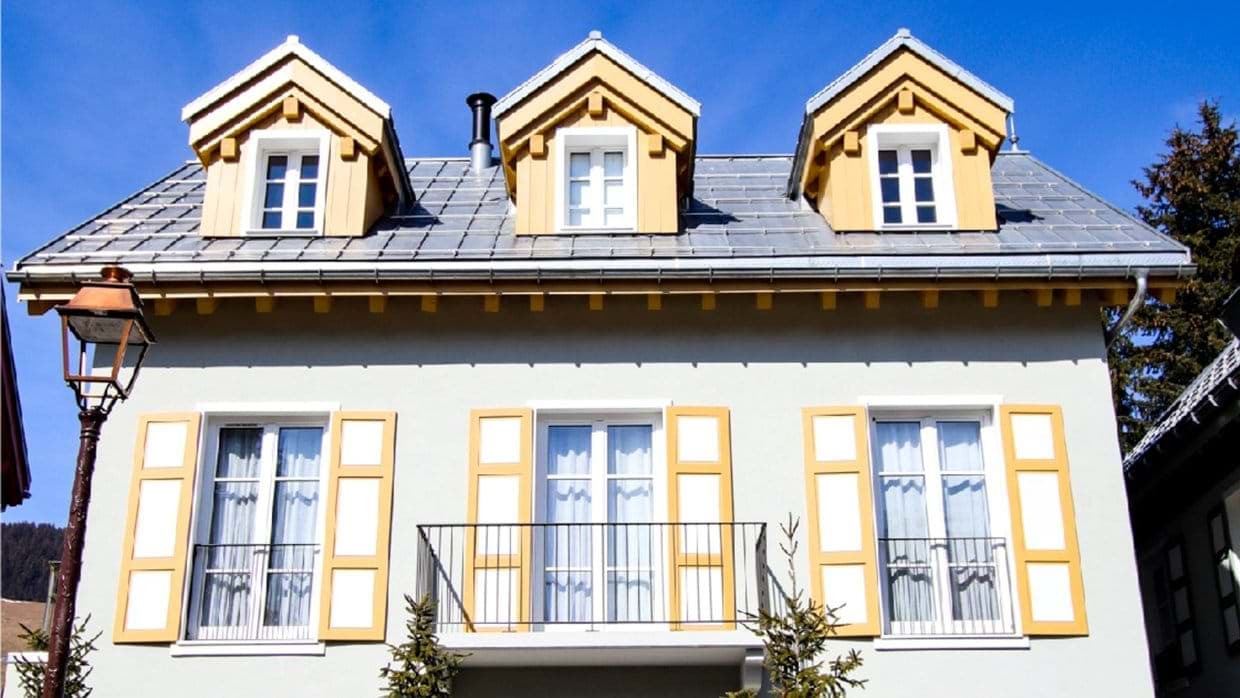 Exterior with metal roof and center Juliet balcony