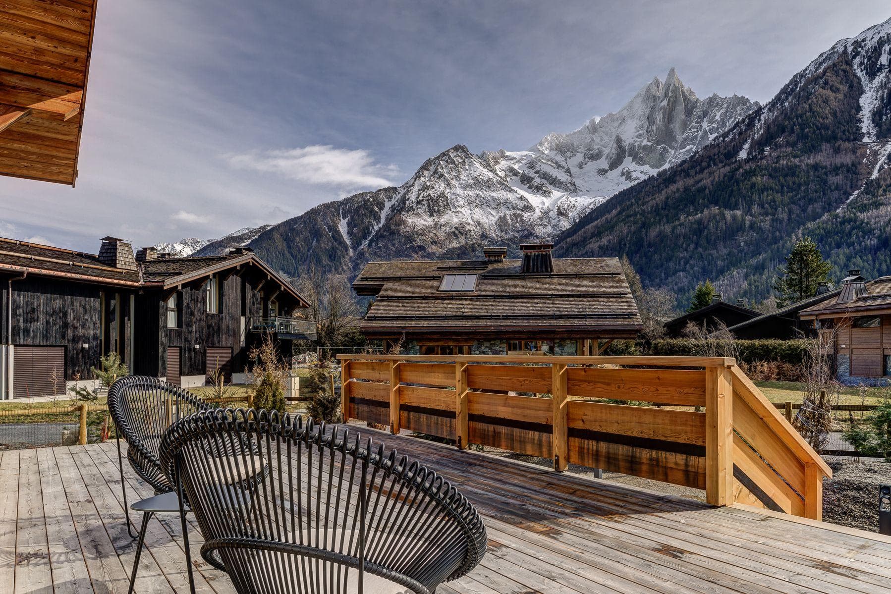 Wooden deck with lounge seating and panoramic mountain views