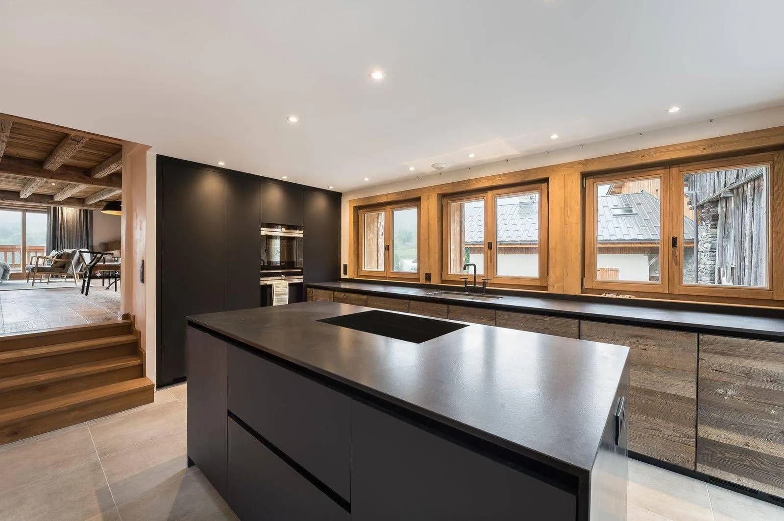 Semi-open fitted kitchen with large central island