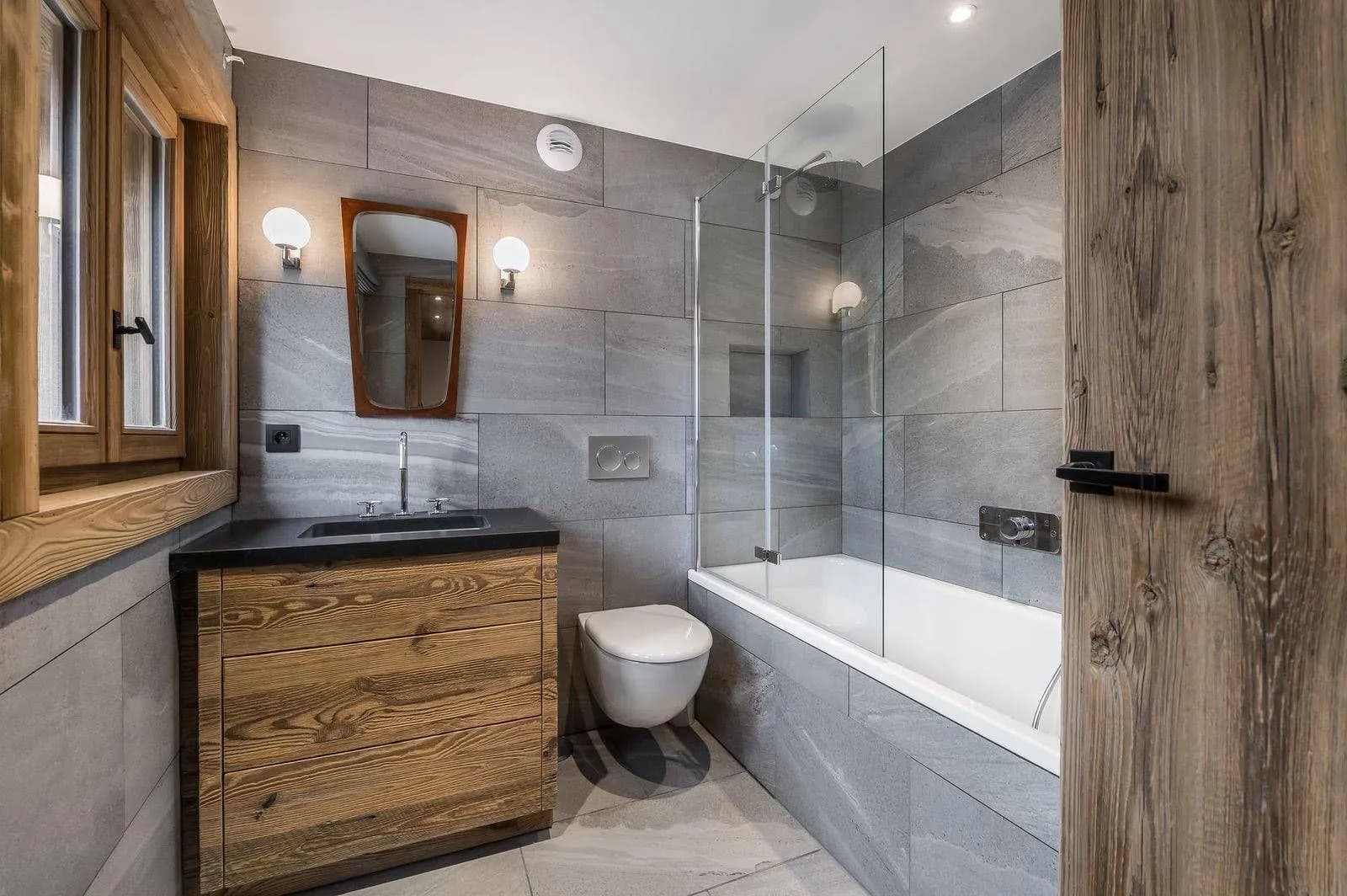En-suite bathroom with bathtub, shower screen and timber vanity