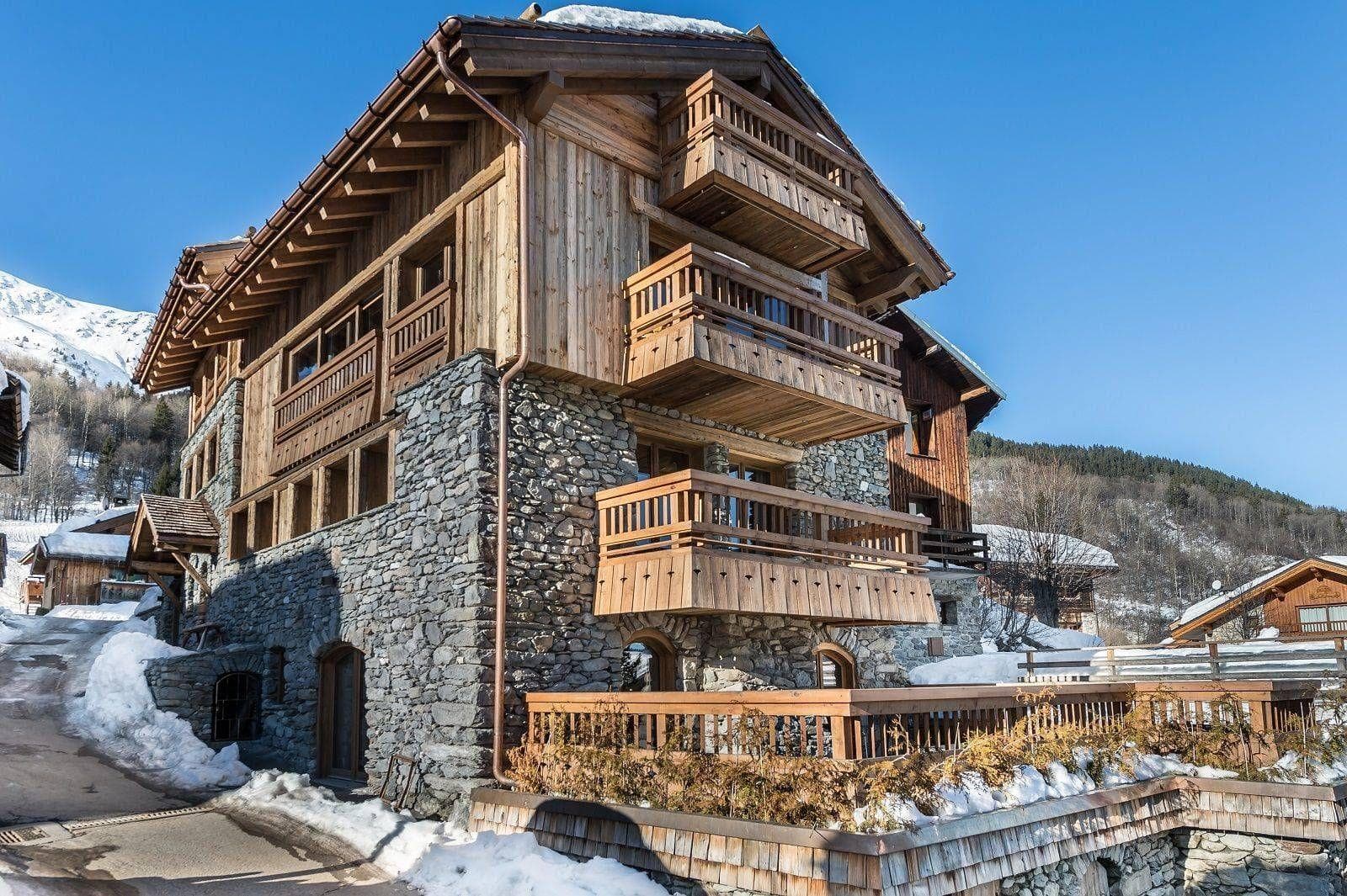 Stone and timber chalet with three private balconies and mountain views