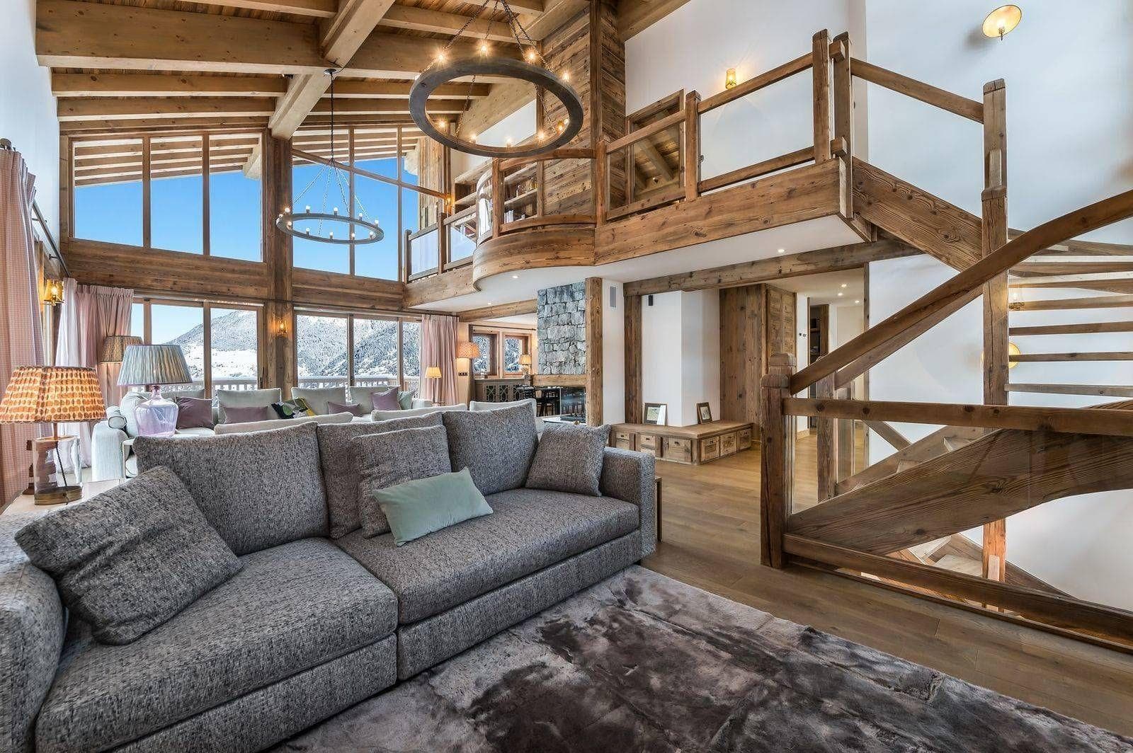 Double-height living room with mezzanine and panoramic glazing