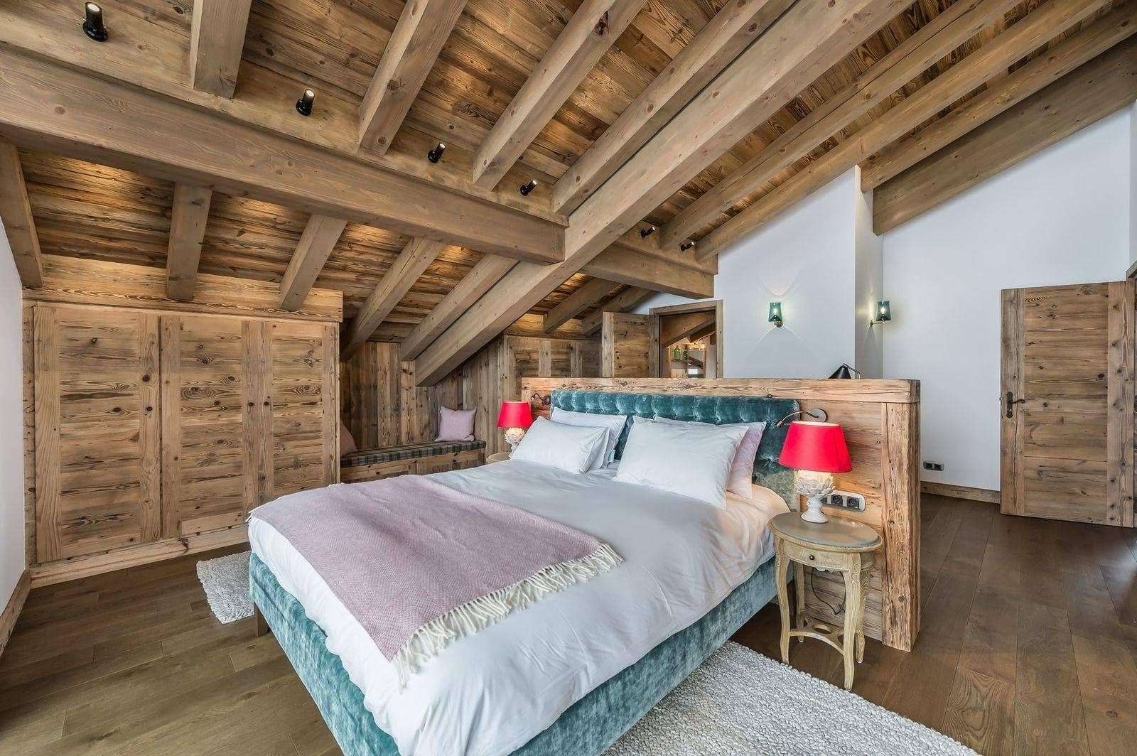 Attic bedroom with king bed and built-in timber wardrobes