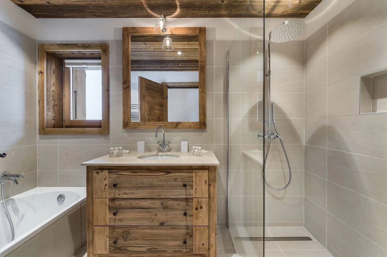 En-suite bathroom with a bathtub, walk-in shower and timber vanity