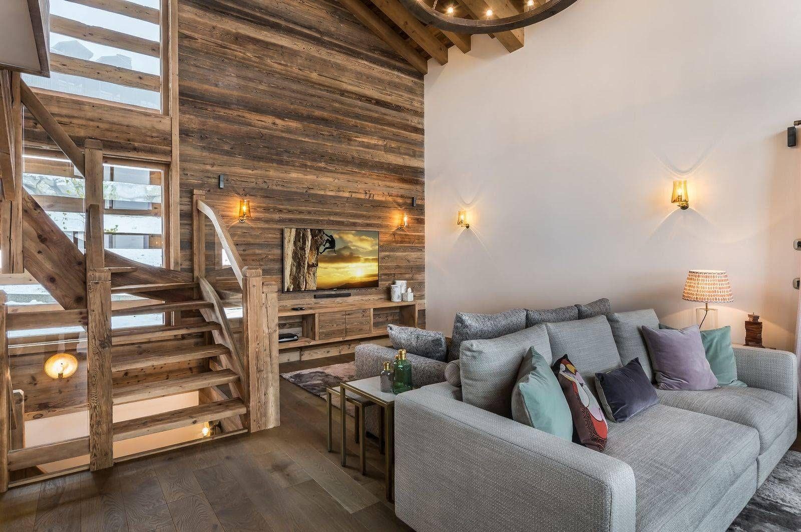 Television lounge with sectional seating and timber wall panels