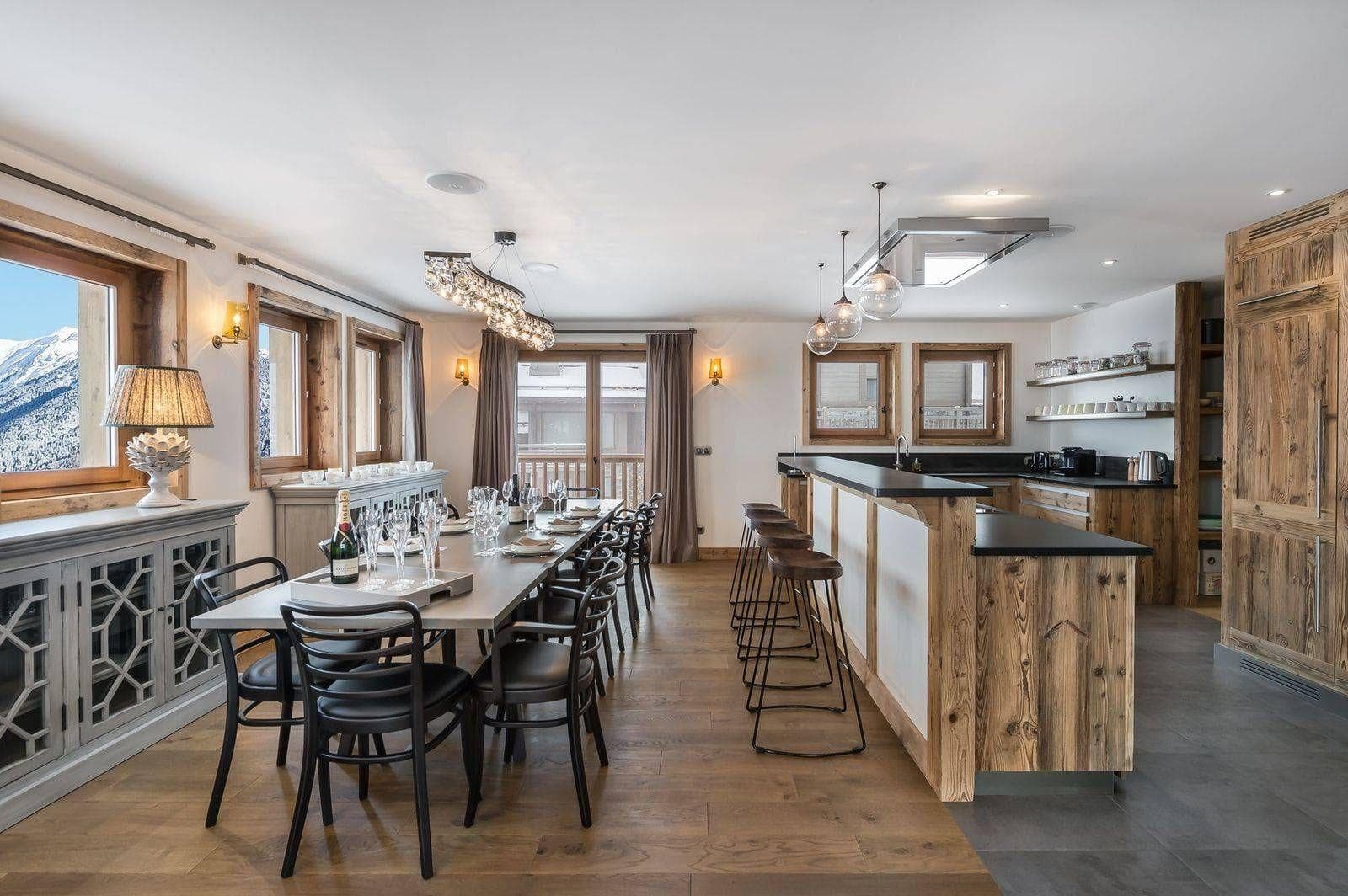 Open-plan dining area seating 10 with breakfast bar and mountain views