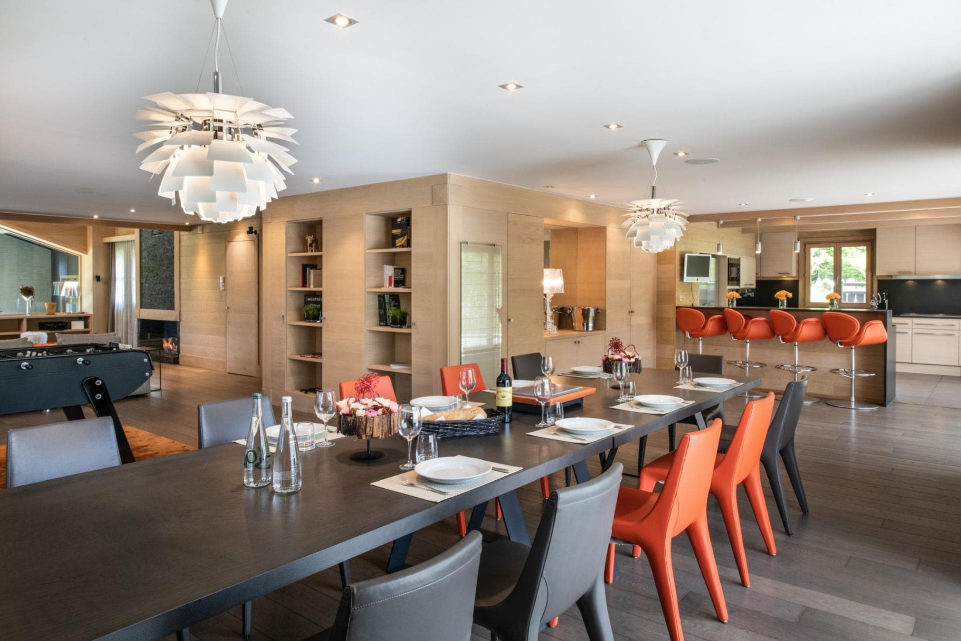 Open-plan dining area seats 12; includes foosball table and breakfast bar