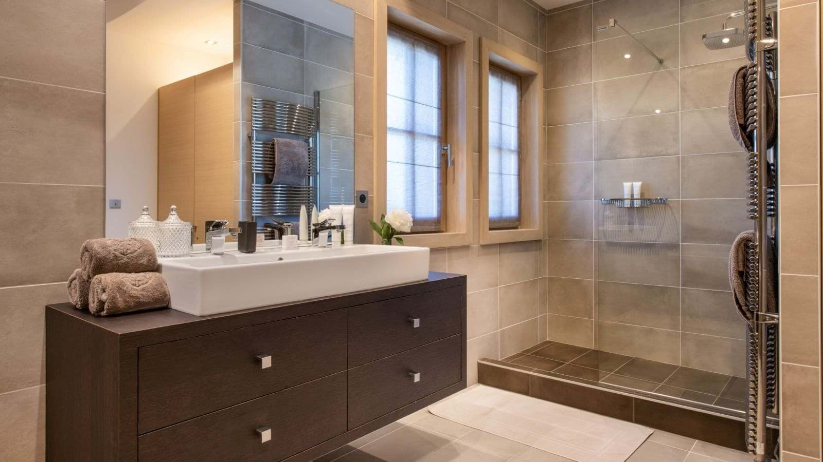 Bathroom with walk-in rainfall shower and heated towel rail