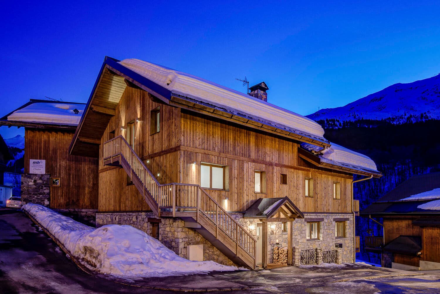 Ski chalet exterior with private entrance and external staircase for upper level