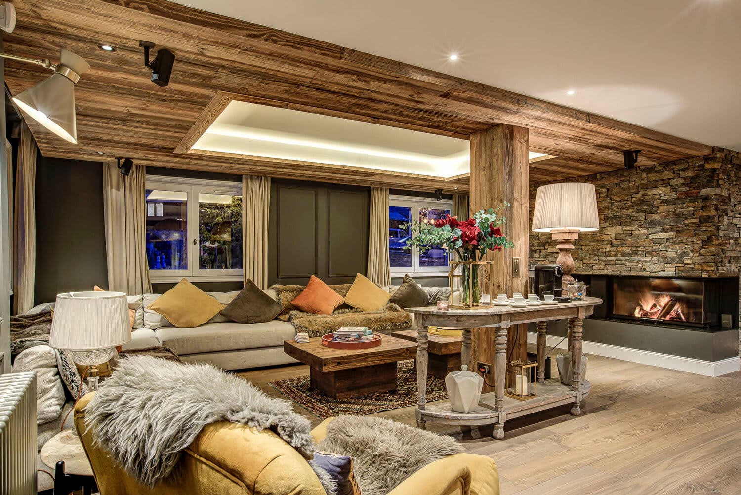 Living area with wood-burning fireplace and sectional seating for 8