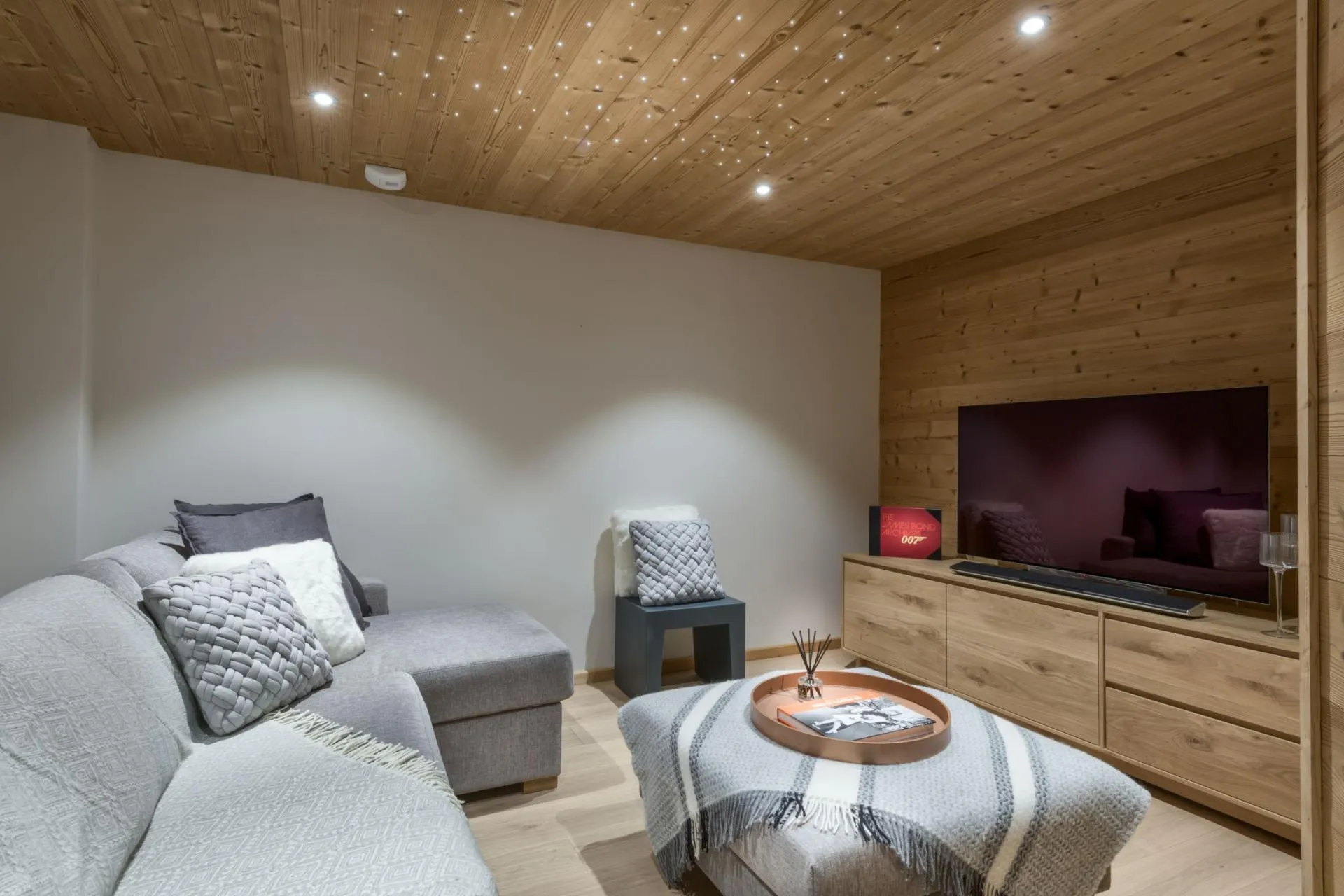 TV room with sectional seating and a fibre-optic star ceiling