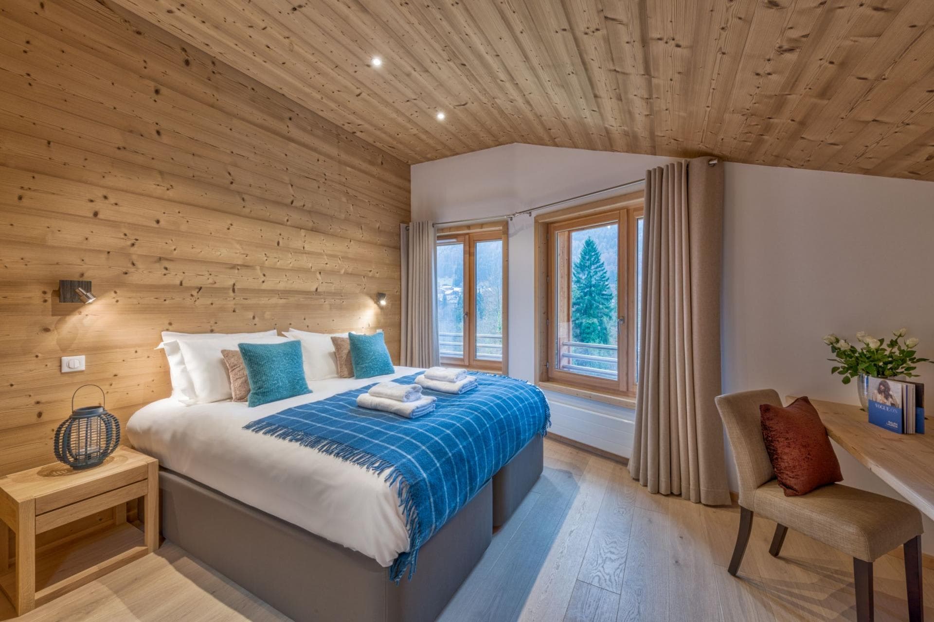 Bedroom with king bed and forest views